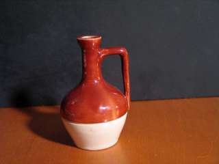 It is approximately 3 1/2 inches tall and the bottom diameter is 1 1/2 