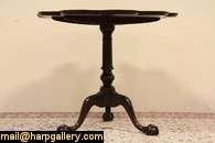   tilt top tea table from the 1920s has a scalloped top with pie crust