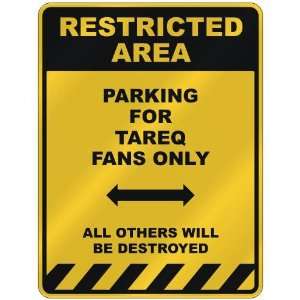  RESTRICTED AREA  PARKING FOR TAREQ FANS ONLY  PARKING 
