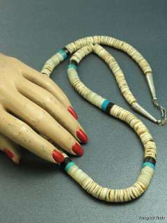   southwestern tribal necklace that is strung with hand made beads it