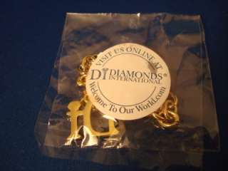   International charm (Di) Gold tone and crystal New & factory sealed